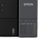 Close-up of an Epson printer's ink cartridge section with four tanks labeled BK, C, M, Y.