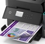 Color printer producing a document with charts and graphs, featuring a purple header on the page.