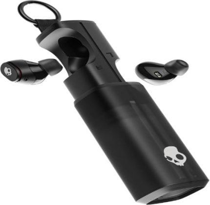 Black true wireless earbuds with a cylindrical charging case, both in black with a white skull logo on the case.