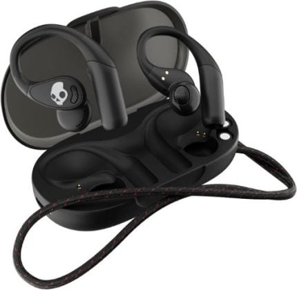 Black wireless earbuds in an open charging case with a braided cable; Skullcandy logo visible on one earbud.